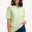 Sugarhill Brighton model wearing a green and white striped shirt with blue jeans on a white background