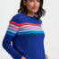 Woman wearing a blue sweater with colorful stripes on a white background