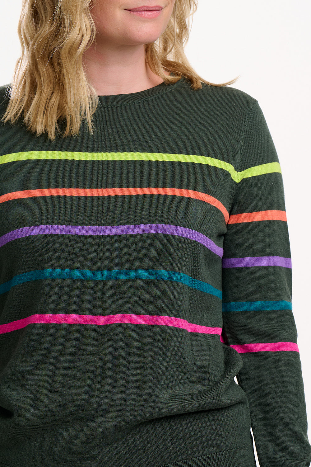 Green sweater with colorful horizontal stripes worn by a person