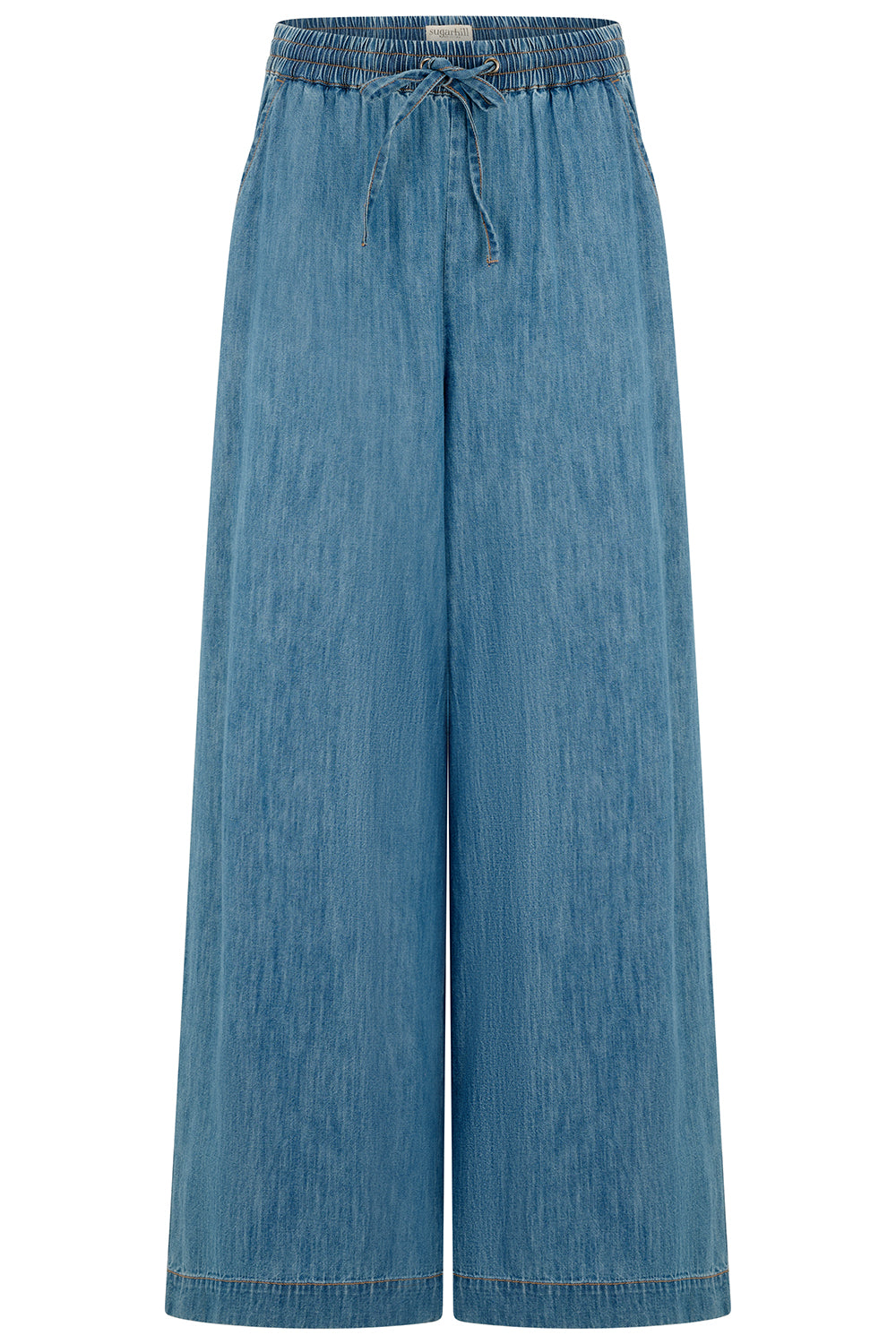 A mid blue denim wide leg trousers with an elasticated drawstring waist and back patch pockets.