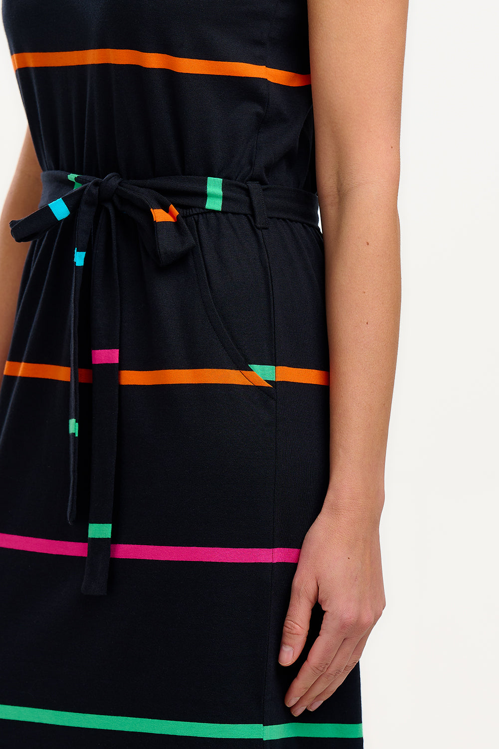 Black dress with colorful horizontal stripes on a white background