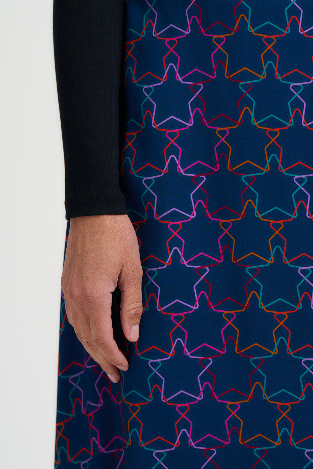 Navy dress with colorful star pattern worn by a person