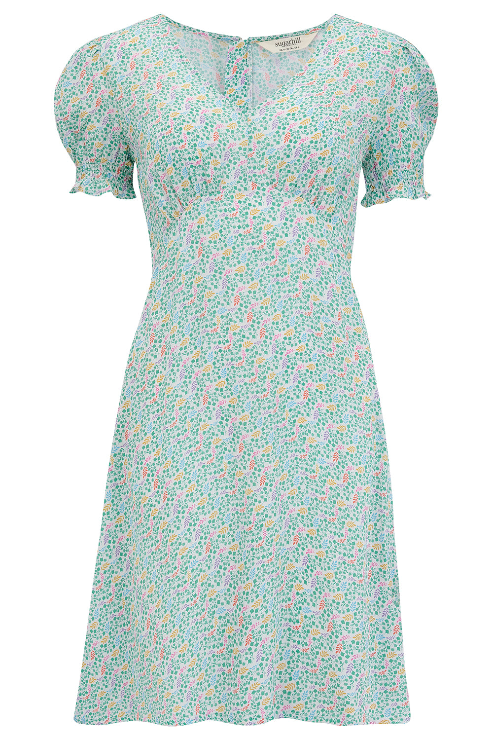 A short off-white mini tea dress with a multicolor floral garden waves pattern, featuring short shirred sleeves.
