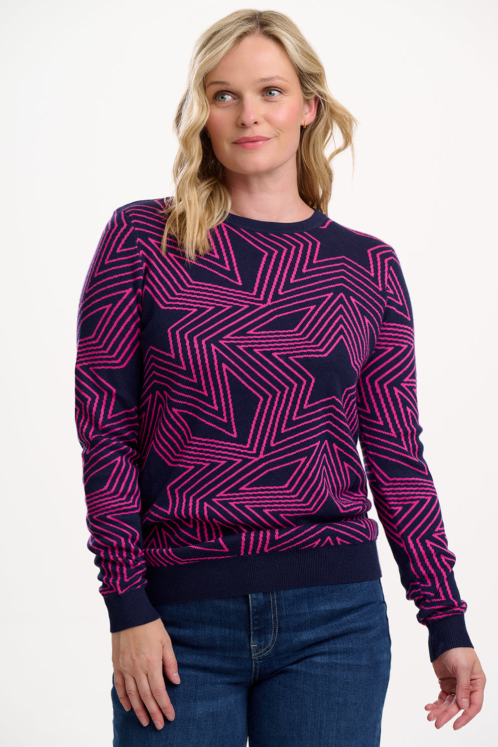Woman wearing a purple and black patterned sweater on a white background