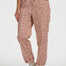 Person wearing leopard print pants on a white background