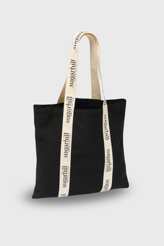 Black tote bag with 'sugarhill' branding on a light gray background