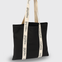 Black tote bag with 'sugarhill' branding on a light gray background