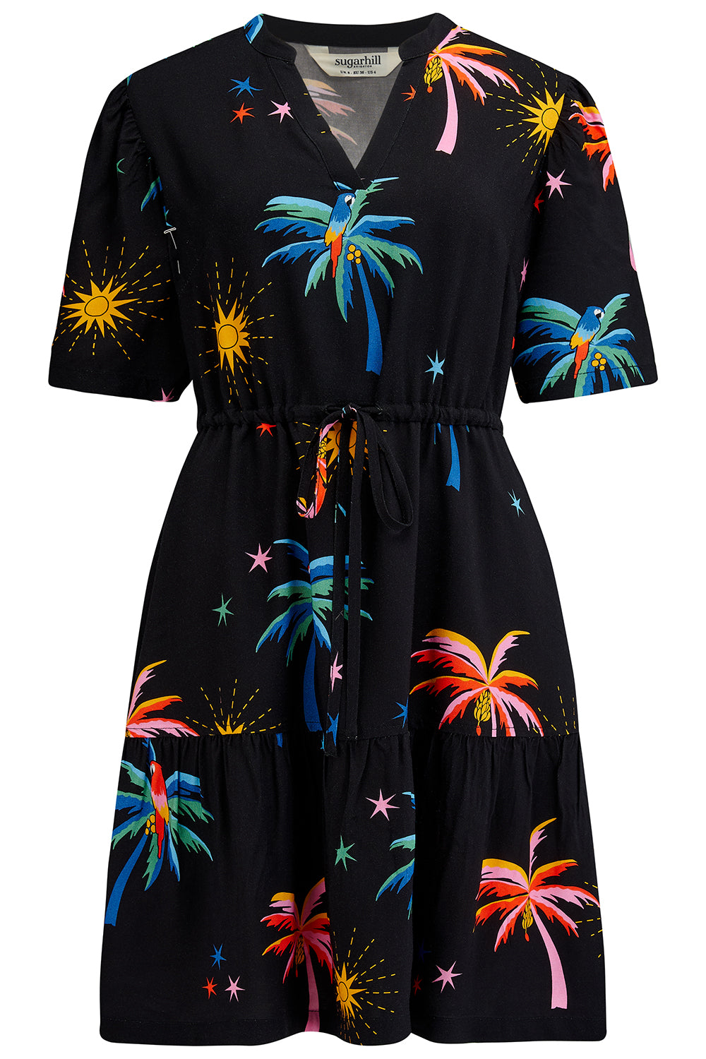 A short-sleeved mini dress with a deep V-neck cut-out, featuring a tiered skirt, palm tree, and other colorful patterns on a black background.