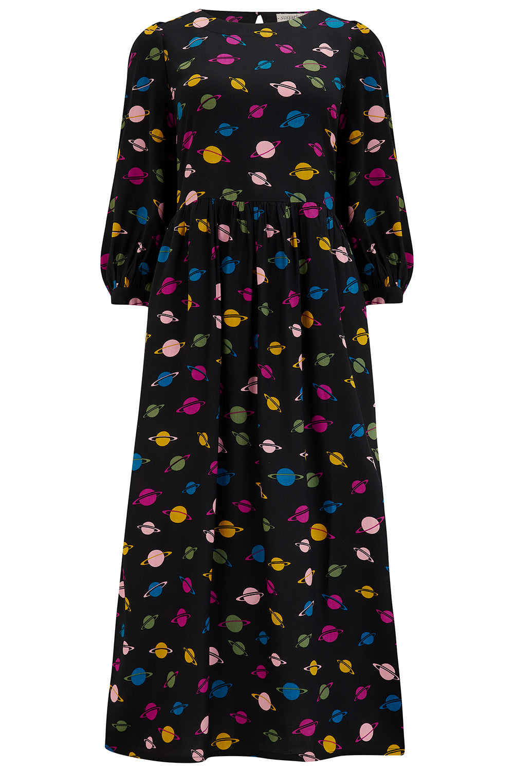 A midi smock dress with a colorful planet pattern on a black background, paired with black boots.