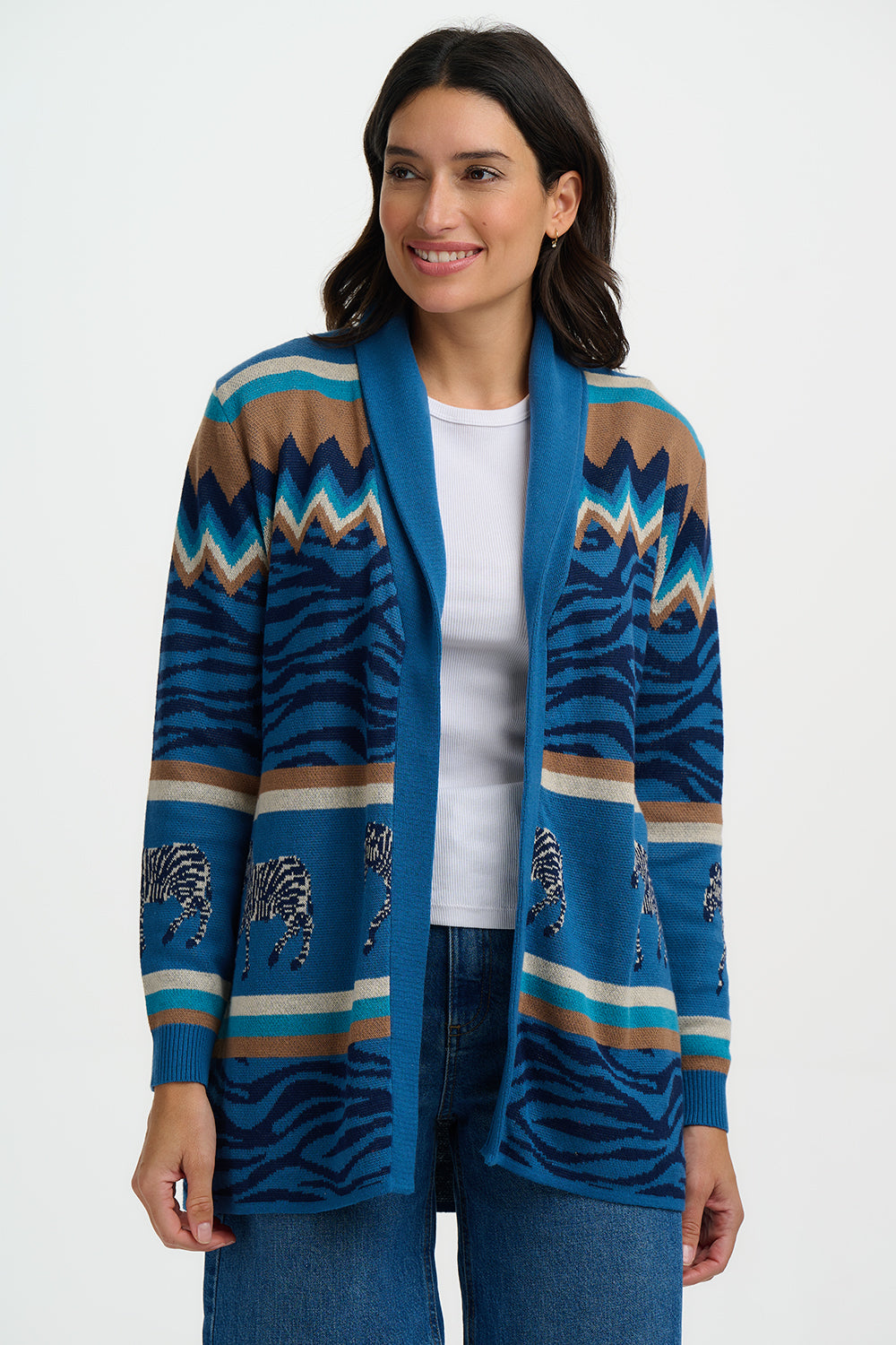 Woman wearing a blue patterned cardigan on a white background