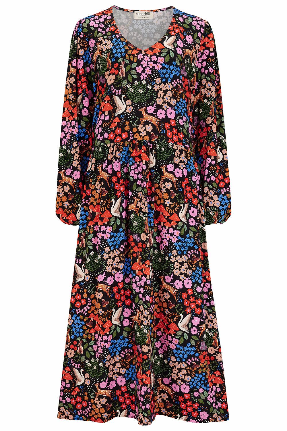 A midi length smock dress with a vibrant woodland floral print, featuring long sleeves and a V-neck.