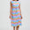 Woman wearing a colorful dress with a white background