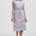 Woman wearing a colorful dress with a white background