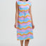 Woman wearing a colorful dress with a white background