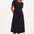 A model wearing a midi-length jersey cotton dress with a round neckline, elasticated waistband, short sleeves, and a pattern of undulating waves in black, red, and green.