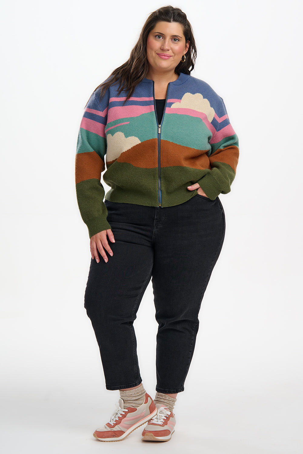 Person wearing a colorful patterned jacket on a white background