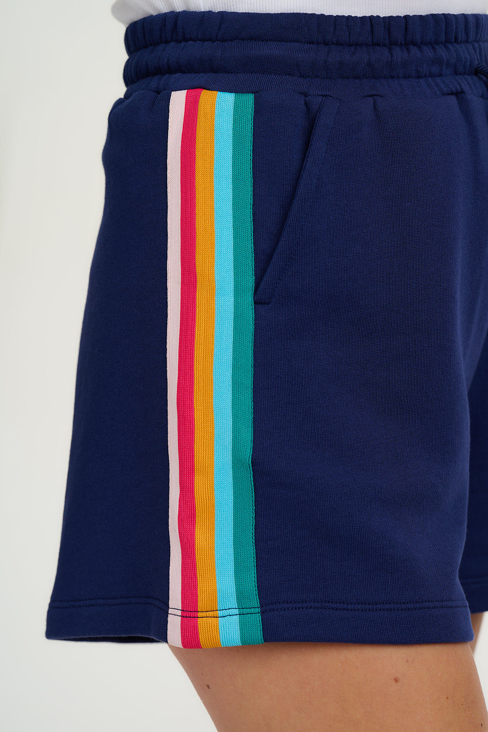 Navy shorts with colorful stripes on a white background