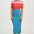 Person wearing a red and white striped top with a blue and yellow striped skirt on a white background