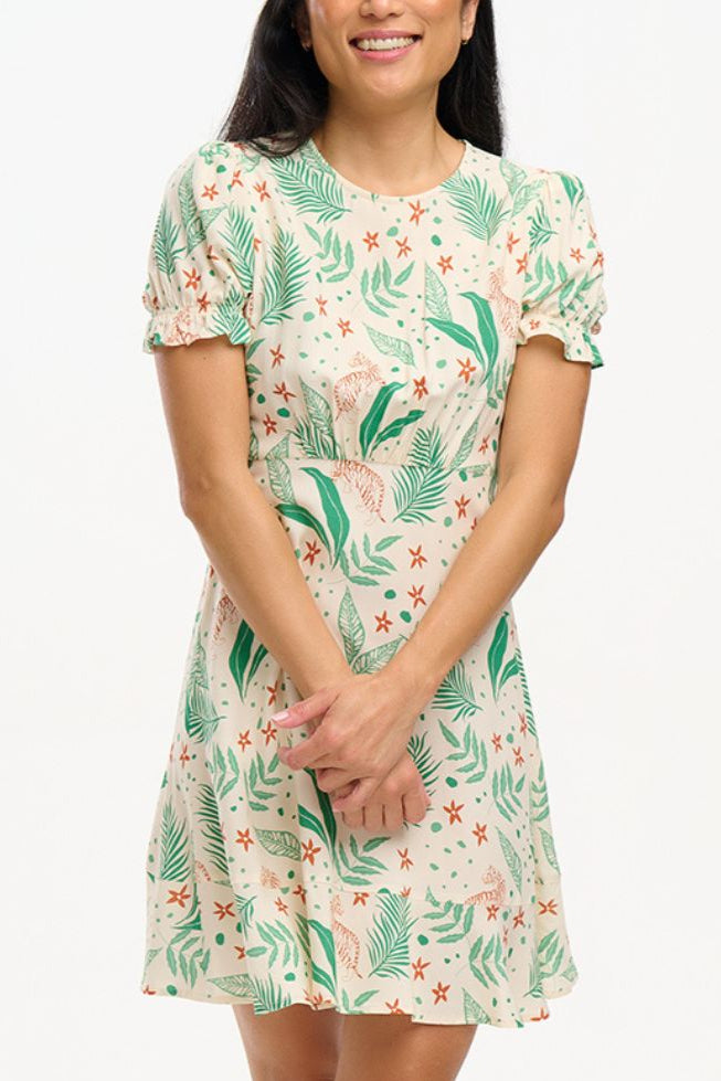 Woman wearing a floral dress with a white background