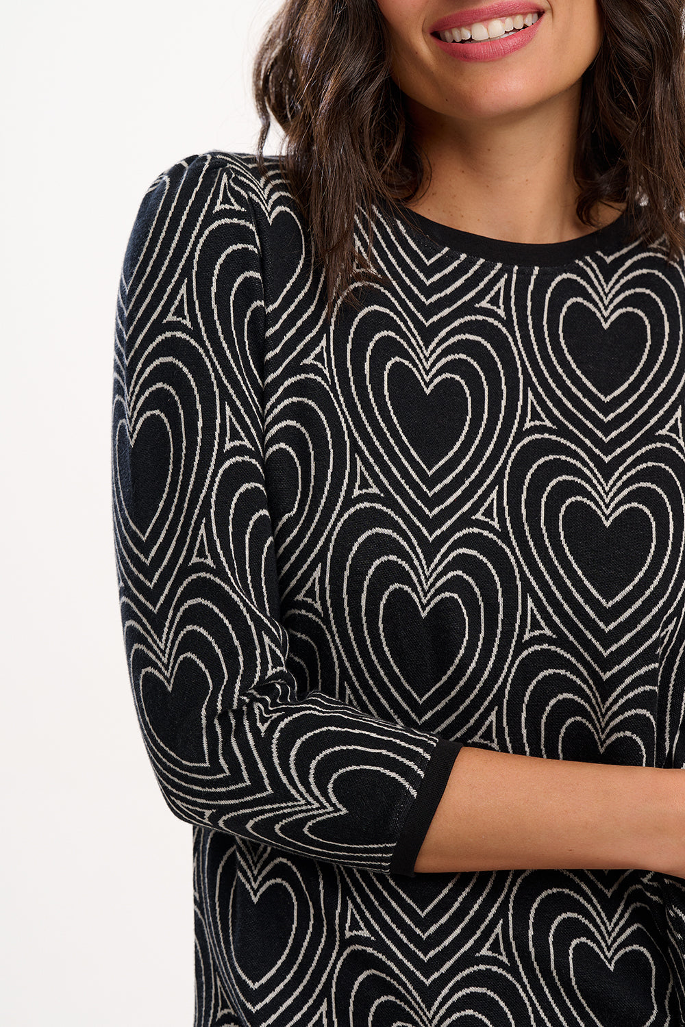 Black and white patterned dress with heart design on a plain background