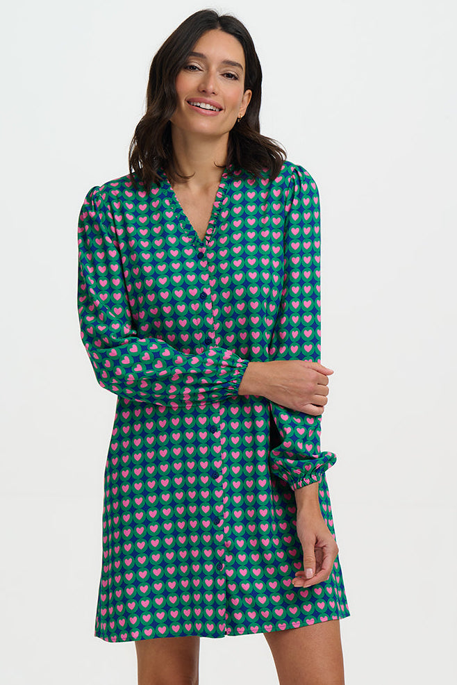 Woman wearing a green checkered dress on a white background