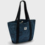 Blue tote bag with black straps on a light gray background