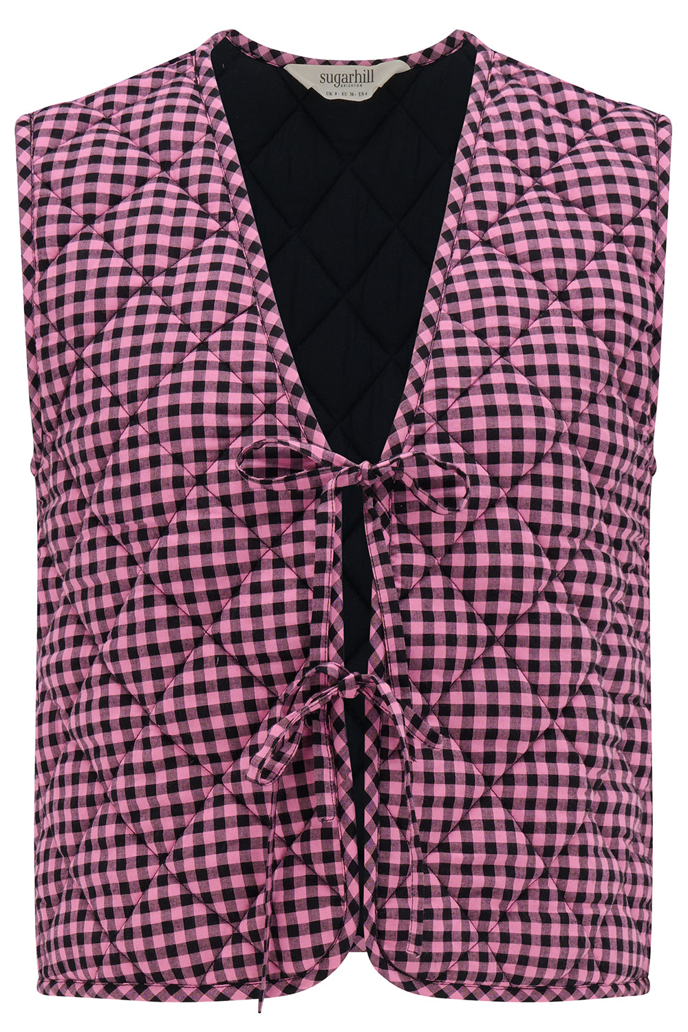 Pink and black checkered vest with a black top underneath on a white background