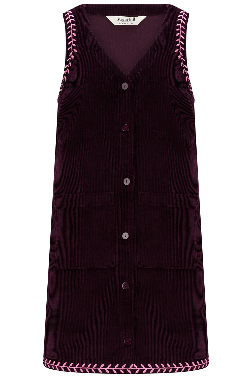 Dark purple corduroy dress with pink stitching on a white background
