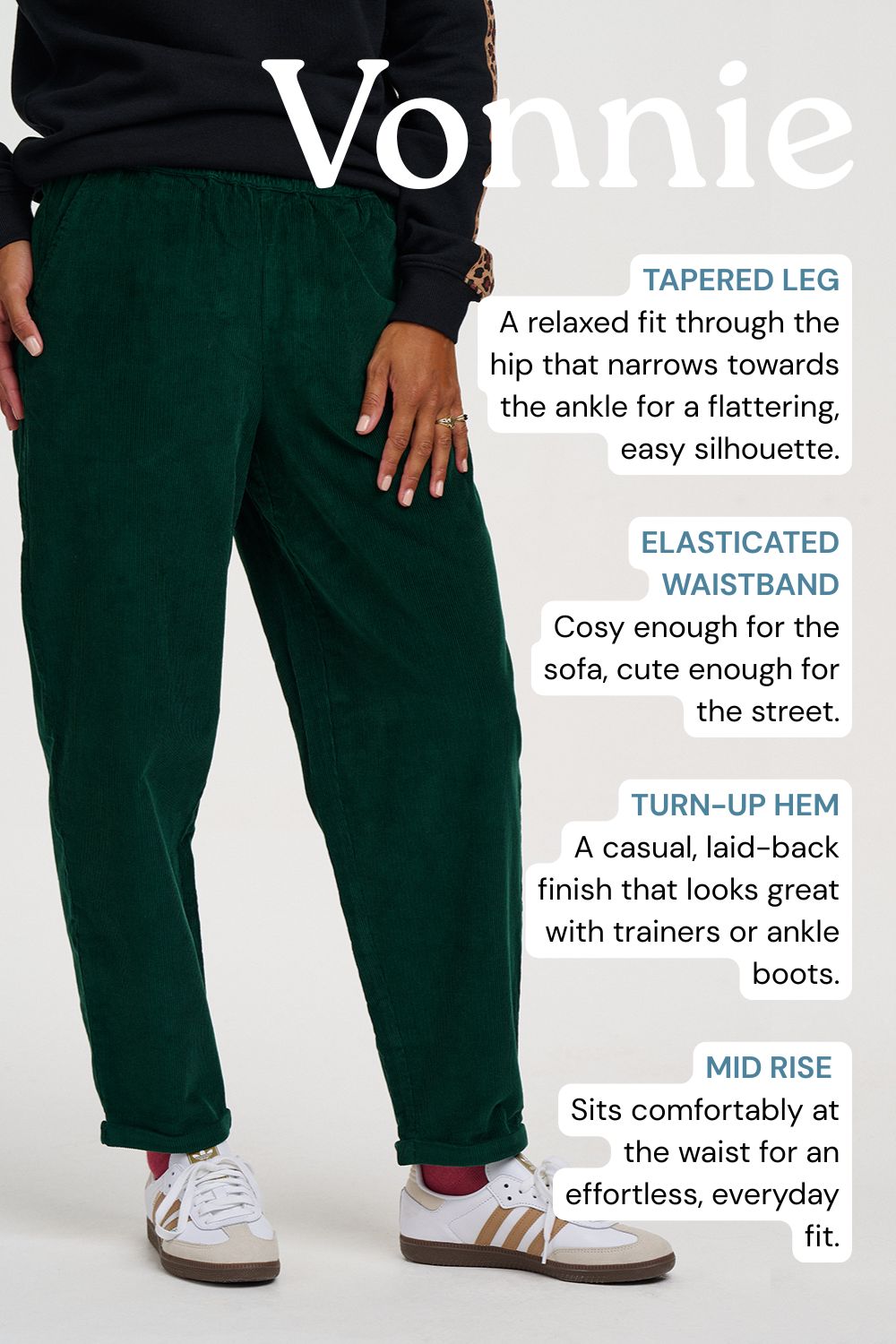 A person wearing dark green tapered corduroy pants with a relaxed fit, styled with white sneakers, on a light gray background with descriptive text overlays.