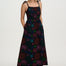 Woman wearing a black floral dress on a white background