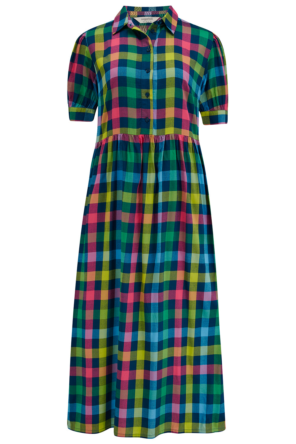 A midi smock dress with a classic shirt bodice and short puff sleeves, featuring a geometric pattern in shades of pink, green, and blue.