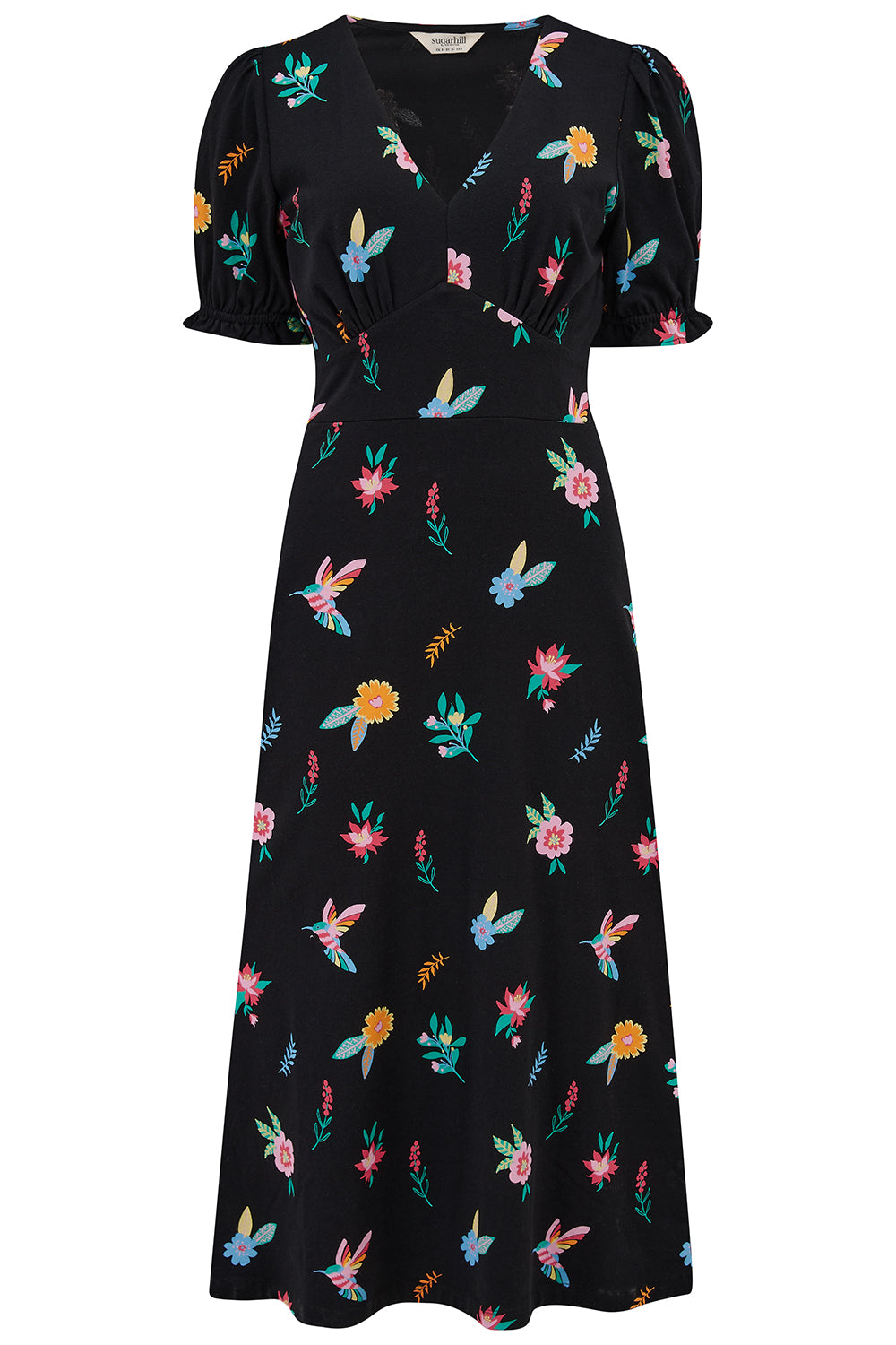 A midi length jersey dress with a deep V-neck and short frill sleeves. The dress has a black base with a colorful hummingbird and garden design.
