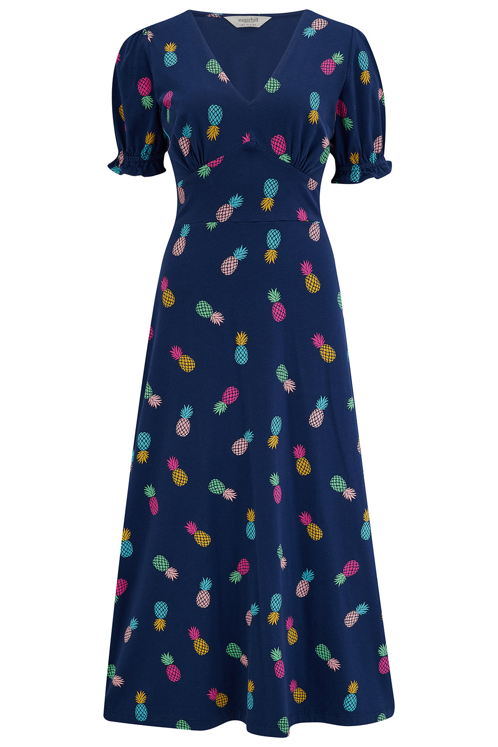 A navy midi tea dress with a multicolor pineapple print, featuring a deep V-neck and short frill sleeves.
