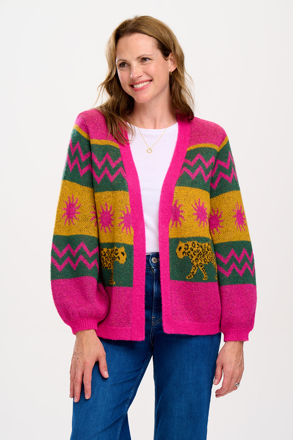 A model wearing a multicoloured cardigan with sun leopard pattern, balloon sleeves, and a relaxed fit.