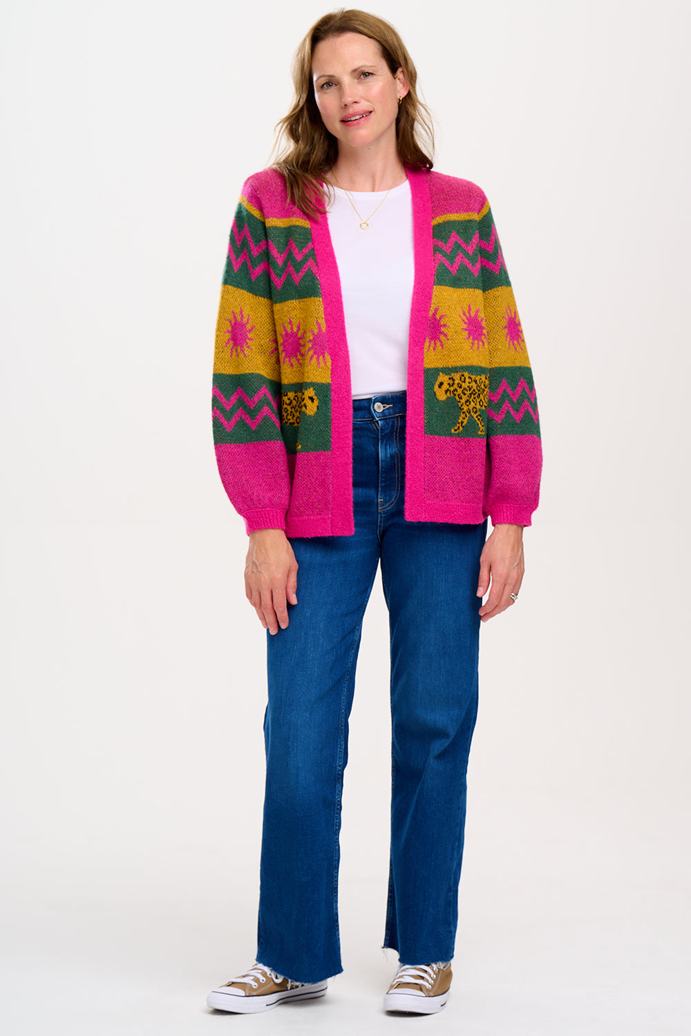 A model wearing a multicoloured cardigan with sun leopard pattern, balloon sleeves, and a relaxed fit.