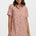 Woman wearing a pink leopard print dress on a white background