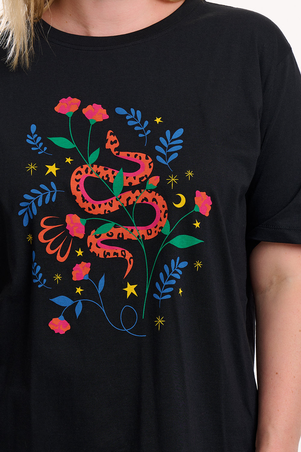 Black t-shirt with a colourful snake and floral design on a plain background